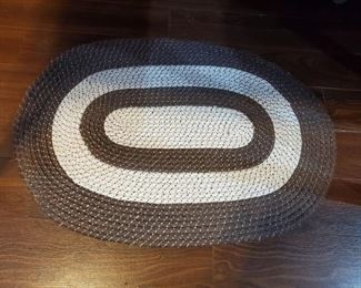 Small brown and white braided rug
