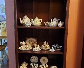 Many tea pots and miniature tea sets 