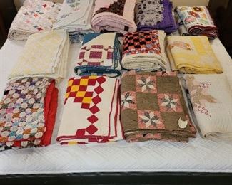 Assorted vintage quilts