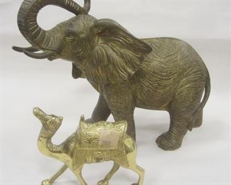 LARGE CAST METAL ELEPHANT AND CAMEL FIGURES. ELEPHANT IS 10" LONG