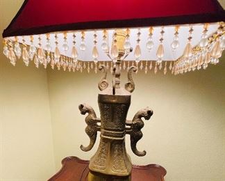 $150  •  #8.  Oriental brass lamps with red shades shades • 30 high 7 1/2 wide
