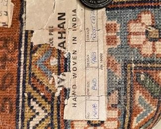 $325 •  #11.  India handwoven wool area rug • 5'x10’