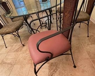 $275  •  #19  Glass oval top bistro dining table, wicker back metal  frame • 4 side chairs & 2 armchairs • 29high 82wide 46deep  • chairs 39 hi 21wide 21 deep