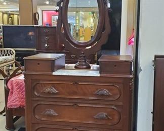 Antique marble top dresser with mirror.
