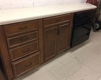 Counter with drawers and storage with Jenn- Air electric oven. The counter is 100" long & 25" deep.