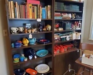 book shelves with vintage children's books, Fiesta pottery and ware