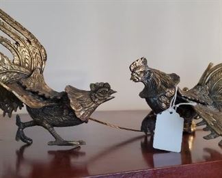 Metal fighting roosters