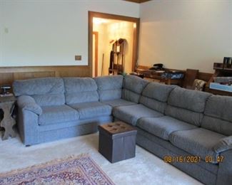 Nice large sectional with the right side being a hida-bed/sleeper