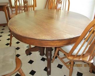 Really old oak pedestal table with 3 leaves