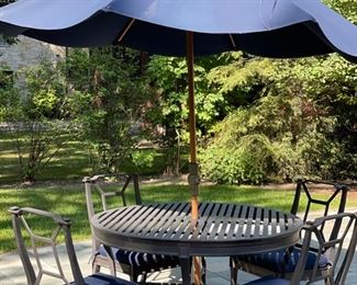 Restoration Hardware wrought iron dining table with four chairs. Seat cushions and umbrella included. Photo 1 of 3. 