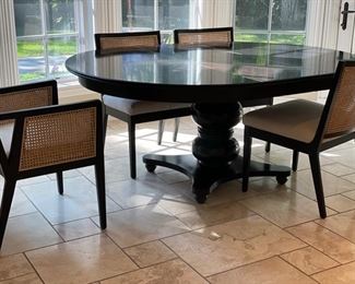 Drexel Heritage 54" round ebony pedestal dining table. Fully extended, table measures 72" W with one 18" leaf. 30" H with 26" H apron. 