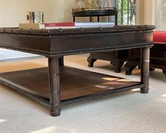 Drexel Heritage cocktail table with faux bamboo frame and cane shelf. Measures 23" W x 55"L x 21" H. 