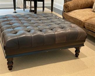 Tobacco-leather tufted upholstered ottoman. Measures 48" x 48" x 18" H. TRUE COLOR.  