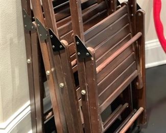 Set of four wood folding chairs. 