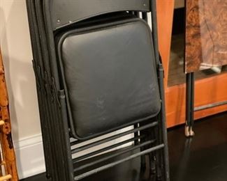 Set of four metal folding chairs. 