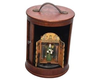45. Cylindrical Wooden Case and Priest Figure