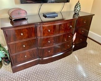 Thomas Pheasant for Baker triple bureau with bowed front in swirl mahogany