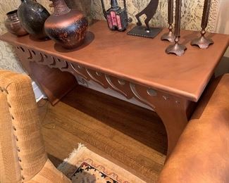 Console table in antique copper finish