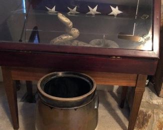 Crockpot, trophy case, and flag