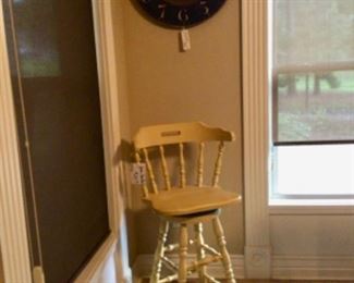 1 Yellow Swivel Barstool & a Wall Clock