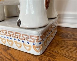 (detail view of damage to the piece)