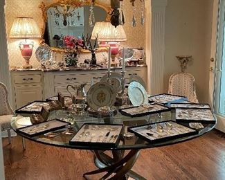 Beautiful glass top table, unique china, sterling silverware.