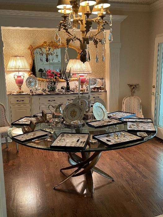 Beautiful glass top table, unique china, sterling silverware.