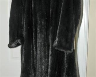 ONE OF THREE FUR COATS
