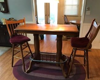 Oval oak bar table & 2 stools.