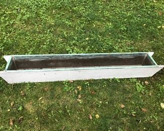 Six foot copper lined trough-style planter.