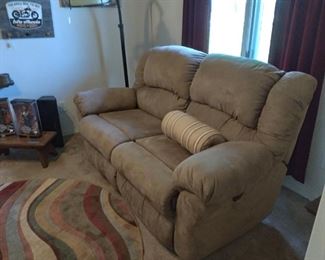 Ultrasuede recliner rocker loveseat. NOTE: One side reclines, the other does not.