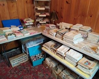 Early 1900s embroidered sheets and pillow cases, vintage towels and hankies. Sewing machine, sewing patterns and miscellaneous sewing items.