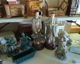 Several jewelry boxes and some larger figurines.
