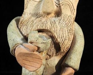 Ceramic Figurine Of Man And Decorative Stone Scroll
