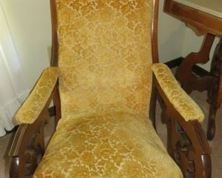 Antique Lincoln Gold Upholstery Rocking Chair with Carved Arms