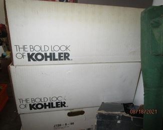 Kohler boxes containing new lavatory sinks.  