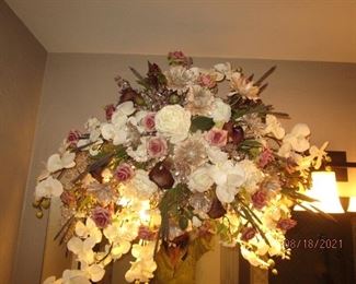 Beautiful Swag Floral arrangment.  Yellow coloring is reflection from light fixture behind the arrangement.  Size is 32 x 30 and it matches the table arrangement in following pic. 