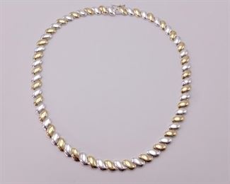 Alternating Silver and Golden Colored Swoosh Link Necklace
