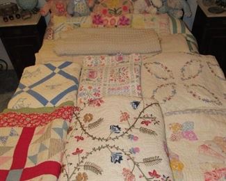 Many hand-sewn quilts