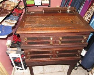 Antique store sewing spool cabinet