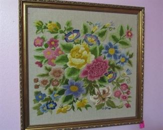 One of several framed embroideries
