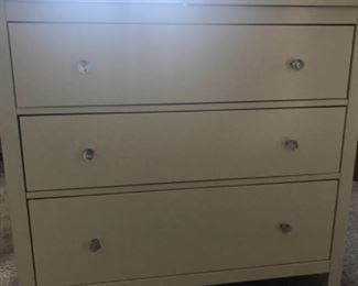 White dresser with glass knobs and glass top