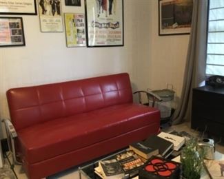 Very unique knife-jack style couch (folds out), glass coffee table, Frank Sinatra books. 