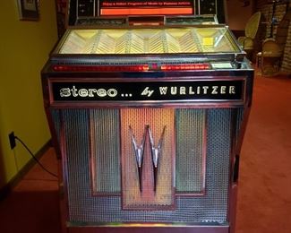 Stereo by Wurlitzer juke box, lights work, plays records but has a speaker problem,. It's cool too!!!