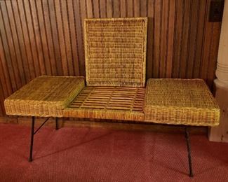 Vintage wicker and iron bench, the center folds down for bench or flips over for a drinks tray