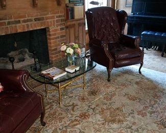 Brass and glass top coffee with the other La-Z-Boy recliner also in as is condition