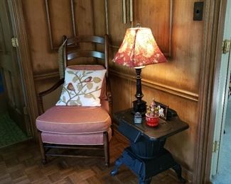 Maple armchair and metal stove used as a side table