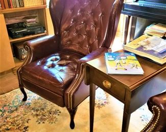 One of two leather La-Z-Boy wing armchairs, both as is