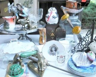 Unpacked boxes show a vary wide variety of items....Haviland Limoges, brass, glassware, souvenir and historical items
