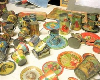 Lots and lots of antique tin litho childrens dishes....just a sampling.   